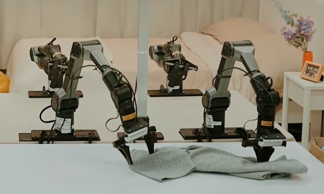 Robot grasps garment